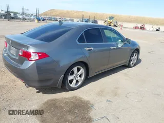 2009 Acura TSX z VIN JH4CU26629C010046, wystawiony jako IAAI lot #42303097 z przebiegiem 157 720 mil mil oraz . Historia ofert i sprzedaży dostępna na DreamBid. Obrazek 4.