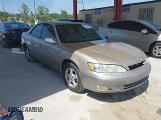 1999 Lexus ES 300 Luxury Sport Sdn with VIN JT8BF28G0X5065317, listed as a IAAI auction lot 42080216 with 163,223 mi miles. Bid and sale history available at carsss.com. Image 1.