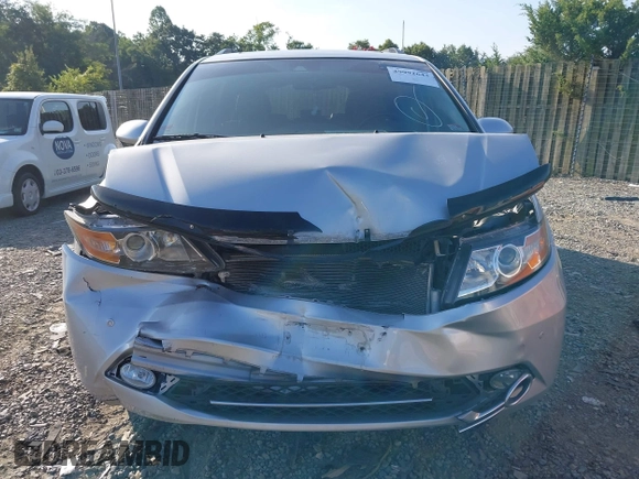 2014 Honda Odyssey Touring with VIN 5FNRL5H95EB108427, listed as a IAAI auction lot 39992643 with 100,658 mi miles and . Bid and sale history available at DreamBid. Image 12.