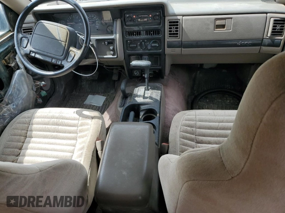 1993 Jeep Grand Cherokee Laredo with VIN 1J4GZ58Y8PC513026, listed as a Copart auction lot 57001465 with 135,242 mi miles and Clean title. Bid and sale history available at DreamBid. Image 8.