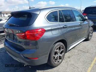 2018 BMW X1 sDrive28i with VIN WBXHU7C36J5L05628, listed as a IAAI auction lot 41708522 with 91,352 mi miles and . Bid and sale history available at DreamBid. Image 4.