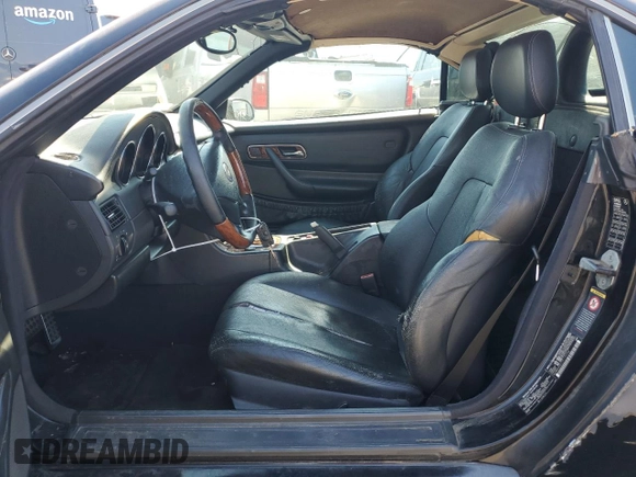 2001 Mercedes-Benz SLK-Class with VIN WDBKK65F71F175734, listed as a Copart auction lot 61874984 with 185,408 mi miles and Salvage Title. Bid and sale history available at carsss.com. Image 7.