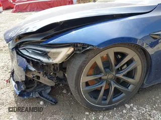 2022 Tesla Model S with VIN 5YJSA1E55NF486443, listed as a IAAI auction lot 42720110 with Not provided miles and . Bid and sale history available at DreamBid. Image 20.