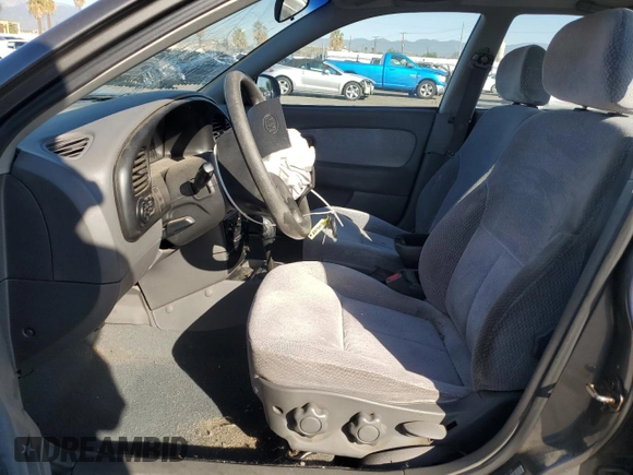 2003 Kia Spectra z VIN KNAFB121335277388, wystawiony jako Copart lot #46756185 z przebiegiem 151 235 mil mil oraz Szkoda całkowita • Salvage title. Historia ofert i sprzedaży dostępna na DreamBid. Obrazek 7.