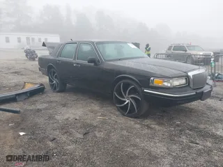1997 Lincoln Town Car Signature with VIN 1LNLM82W4VY630979, listed as a IAAI auction lot 41775990 with 1 mi miles. Bid and sale history available at carsss.com. Image 1.