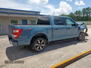 2023 Ford F-150 XL with VIN 1FTEW1CP7PKD02399, listed as a Copart auction lot 60738155 with 23,059 mi miles and Salvage title. Bid and sale history available at DreamBid. Image 3.
