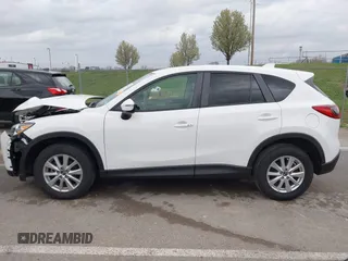 2015 Mazda CX-5 Touring with VIN JM3KE2CY3F0550624, listed as a IAAI auction lot 41931268 with 51,588 mi miles and . Bid and sale history available at carsss.com. Image 14.