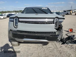 2025 Rivian R1S Adventure z VIN 7PDSGBBA5SN045424, wystawiony jako Copart lot #49675655 z przebiegiem Nie podano mil oraz Szkoda całkowita • Salvage title. Historia ofert i sprzedaży dostępna na DreamBid. Obrazek 5.