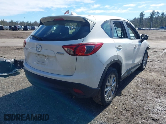 2016 Mazda CX-5 Sport with VIN JM3KE2BY9G0887110, listed as a IAAI auction lot 41761039 with 86,624 mi miles. Bid and sale history available at carsss.com. Image 4.