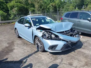 2023 Honda Civic Touring with VIN 2HGFE1F90PH301673, listed as a IAAI auction lot 42562031 with 18,765 mi miles and . Bid and sale history available at DreamBid. Image 1.