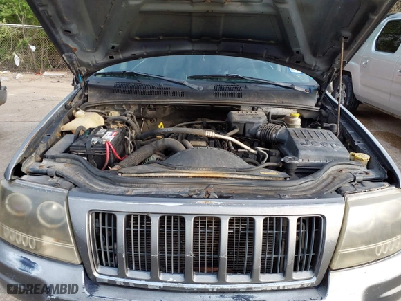 2004 Jeep Grand Cherokee Laredo with VIN 1J4GX48S14C218695, listed as a IAAI auction lot 41933611 with 158,290 mi miles. Bid and sale history available at carsss.com. Image 10.