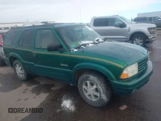 1999 Oldsmobile Bravada z VIN 1GHDT13W7X2711363, wystawiony jako IAAI lot #41294782 z przebiegiem 198 508 mil mil oraz . Historia ofert i sprzedaży dostępna na DreamBid. Obrazek 1.