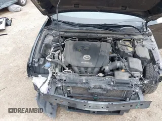 2021 Mazda 3 Preferred with VIN JM1BPBCL4M1328334, listed as a IAAI auction lot 42186709 with 119,926 mi miles and . Bid and sale history available at DreamBid. Image 10.