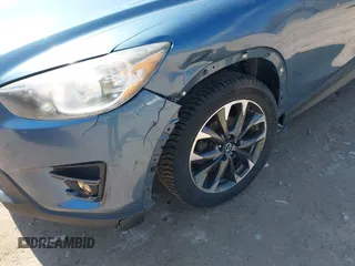 2016 Mazda CX-5 Grand Touring z VIN JM3KE4DY6G0785255, wystawiony jako IAAI lot #41887066 z przebiegiem 171 334 mil mil oraz . Historia ofert i sprzedaży dostępna na DreamBid. Obrazek 6.