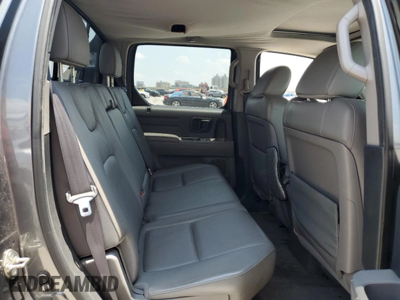 2012 Honda Ridgeline RTL z VIN 5FPYK1F54CB451175, wystawiony jako Copart lot #59536285 z przebiegiem 160 476 mil mil oraz Szkoda całkowita • Salvage title. Historia ofert i sprzedaży dostępna na DreamBid. Obrazek 10.