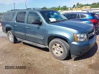 2009 Chevrolet Suburban LS z VIN 1GNFC16079R291885, wystawiony jako IAAI lot #42352913 z przebiegiem 191 994 mil mil oraz . Historia ofert i sprzedaży dostępna na DreamBid. Obrazek 1.