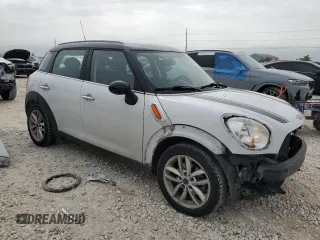 2013 MINI Countryman with VIN WMWZB3C5XDWM31620, listed as a Copart auction lot 51096035 with 93,928 mi miles and Salvage title. Bid and sale history available at DreamBid. Image 4.
