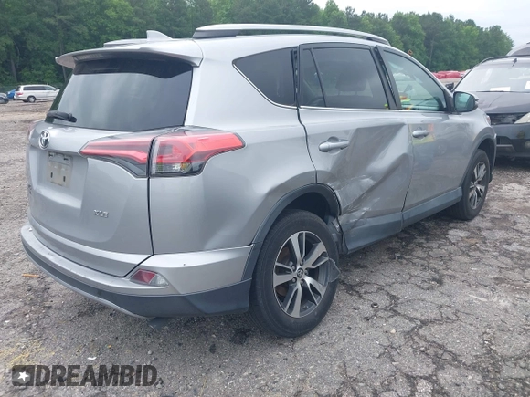 2018 Toyota RAV4 XLE with VIN 2T3WFREV4JW486939, listed as a IAAI auction lot 42355448 with 133,655 mi miles and . Bid and sale history available at DreamBid. Image 4.