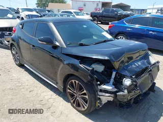 2016 Hyundai Veloster Turbo with VIN KMHTC6AE5GU281597, listed as a IAAI auction lot 42006038 with 77,642 mi miles. Bid and sale history available at carsss.com. Image 1.