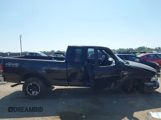 1999 Ford F-150 XL with VIN 1FTRX18L3XKA77743, listed as a IAAI auction lot 42512532 with Not provided miles and . Bid and sale history available at DreamBid. Image 14.