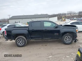 2021 GMC Canyon 4WD AT4 w/Leather with VIN 1GTG6FEN4M1103068, listed as a IAAI auction lot 41673275 with 62,254 mi miles. Bid and sale history available at carsss.com. Image 13.