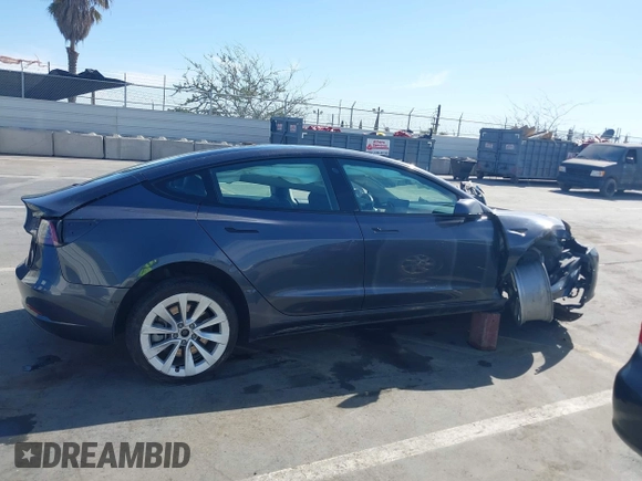 2022 Tesla Model 3 with VIN 5YJ3E1EA1NF142713, listed as a IAAI auction lot 42027630 with 112,557 mi miles. Bid and sale history available at carsss.com. Image 12.