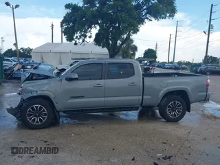 2020 Toyota Tacoma SR5 with VIN 3TMDZ5BN3LM080702, listed as a IAAI auction lot 42463811 with 70,185 mi miles and . Bid and sale history available at DreamBid. Image 14.