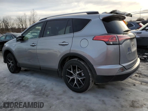 2018 Toyota RAV4 Hybrid SE z VIN JTMJJREV0JD246230, wystawiony jako Copart lot #89095135 z przebiegiem Nie podano mil oraz Szkoda całkowita • Salvage title. Historia ofert i sprzedaży dostępna na DreamBid. Obrazek 2.