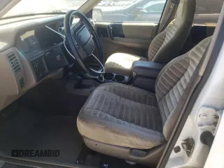 1994 Jeep Grand Cherokee Laredo with VIN 1J4GZ58Y7RC113333, listed as a Copart auction lot 57995734 with 220,950 mi miles and Clean Title. Bid and sale history available at carsss.com. Image 7.