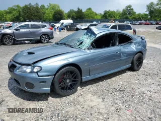 2005 Pontiac GTO z VIN 6G2VX12UX5L352121, wystawiony jako Copart lot #56840425 z przebiegiem 42 265 mil mil oraz Szkody całkowita. Historia ofert i sprzedaży dostępna na DreamBid. Obrazek 1.