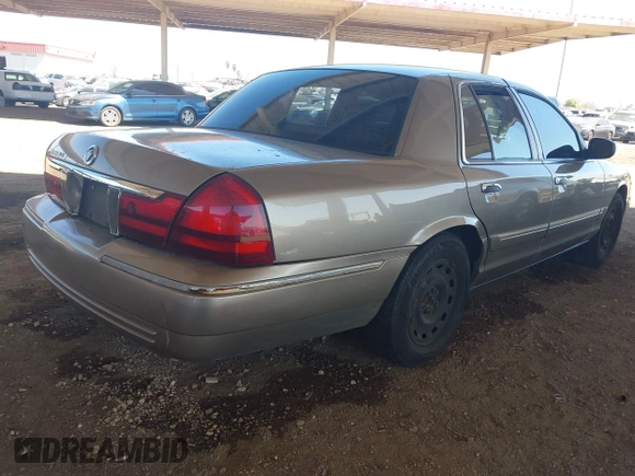 2004 Mercury Grand Marquis GS z VIN 2MEFM74W44X661154, wystawiony jako IAAI lot #42268675 z przebiegiem 236 456 mil mil oraz . Historia ofert i sprzedaży dostępna na DreamBid. Obrazek 4.