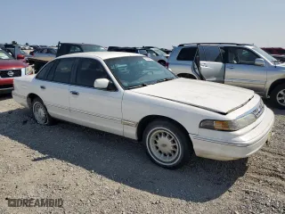1996 Ford Crown Victoria LX with VIN 2FALP7466TX103371, listed as a Copart auction lot 70654804 with 160,147 mi miles and Non Repairable. Bid and sale history available at carsss.com. Image 4.