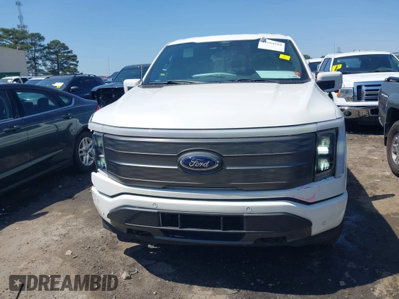 2022 Ford F-150 Lightning Pro z VIN 1FTVW1EL3NWG16227, wystawiony jako IAAI lot #41994584 z przebiegiem 23 341 mil mil oraz . Historia ofert i sprzedaży dostępna na DreamBid. Obrazek 12.