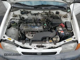 1996 Toyota Tercel DX z VIN JT2AC52L9T0189356, wystawiony jako Copart lot #75311564 z przebiegiem 155 248 mil mil oraz Szkody całkowita. Historia ofert i sprzedaży dostępna na DreamBid. Obrazek 13.