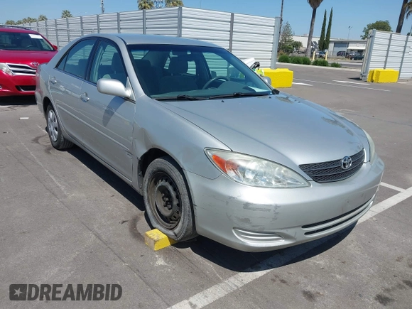 2004 Toyota Camry LE with VIN 4T1BE32K74U300025, listed as a IAAI auction lot 42035954 with 115,203 mi miles. Bid and sale history available at carsss.com. Image 1.