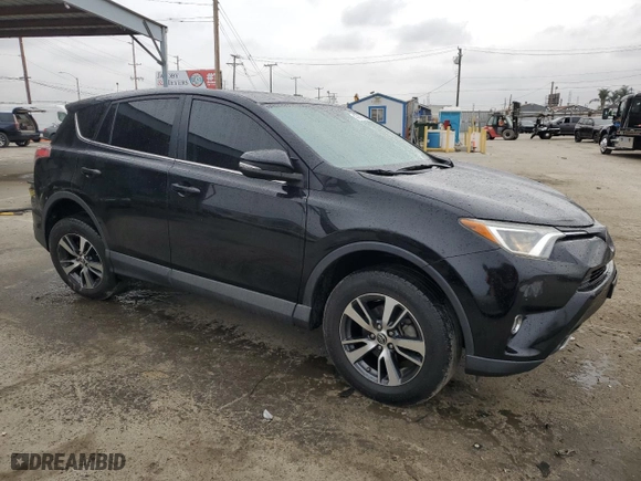 2018 Toyota RAV4 XLE with VIN 2T3WFREV2JW477138, listed as a Copart auction lot 47991815 with 128,417 mi miles and Salvage Title. Bid and sale history available at carsss.com. Image 4.