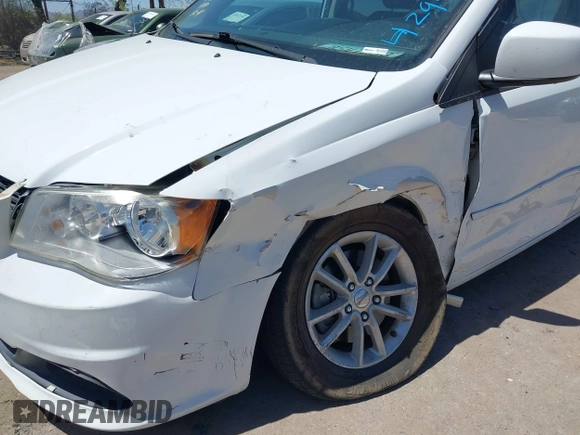 2014 Dodge Grand Caravan SXT with VIN 2C4RDGCG1ER429495, listed as a IAAI auction lot 42058513 with 136,936 mi miles and . Bid and sale history available at DreamBid. Image 6.