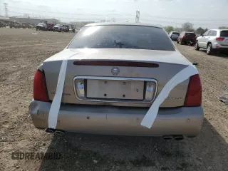 2001 Cadillac DeVille z VIN 1G6KD54YX1U242656, wystawiony jako Copart lot #54566105 z przebiegiem 200 016 mil mil oraz Szkoda całkowita • Salvage title. Historia ofert i sprzedaży dostępna na DreamBid. Obrazek 6.