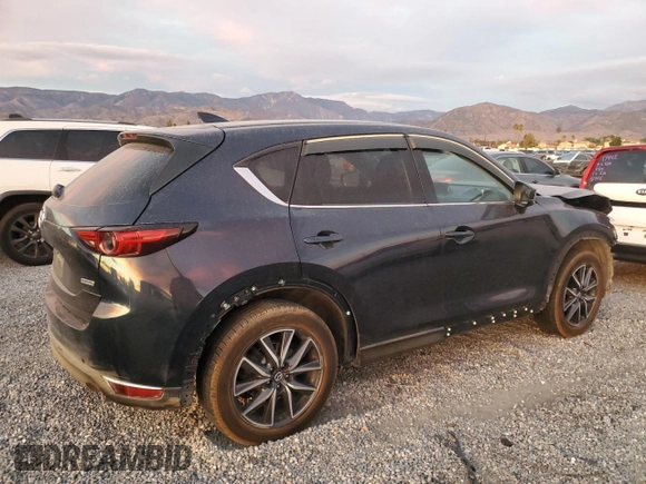 2018 Mazda CX-5 Grand Touring with VIN JM3KFBDM9J1326933, listed as a Copart auction lot 82180164 with 99,574 mi miles and Salvage title. Bid and sale history available at DreamBid. Image 3.