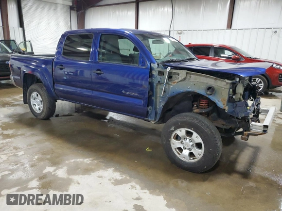 2015 Toyota Tacoma with VIN 3TMLU4EN6FM186016, listed as a Copart auction lot 58404675 with 127,536 mi miles and Salvage title. Bid and sale history available at DreamBid. Image 4.