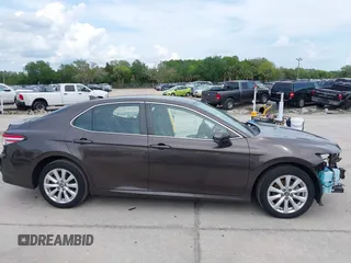 2019 Toyota Camry LE with VIN 4T1B11HKXKU818442, listed as a IAAI auction lot 41906128 with 30,728 mi miles and . Bid and sale history available at DreamBid. Image 14.