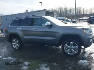 2013 Jeep Grand Cherokee Overland with VIN 1C4RJFCG8DC581719, listed as a IAAI auction lot 41566666 with 152,332 mi miles. Bid and sale history available at carsss.com. Image 13.