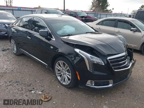 2018 Cadillac XTS Luxury with VIN 2G61M5S31J9135706, listed as a IAAI auction lot 41572396 with 140,539 mi miles. Bid and sale history available at carsss.com. Image 1.