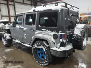 2013 Jeep Wrangler Unlimited Sport z VIN 1C4BJWDG3DL628784, wystawiony jako IAAI lot #41311183 z przebiegiem 125 118 mil mil oraz . Historia ofert i sprzedaży dostępna na DreamBid. Obrazek 3.