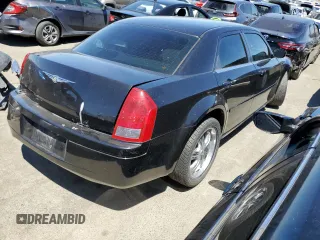 2005 Chrysler 300 with VIN 2C3JA43R95H161005, listed as a Copart auction lot 60951874 with 147,903 mi miles and Salvage Title. Bid and sale history available at carsss.com. Image 3.