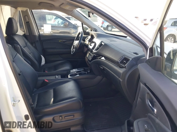 2022 Honda Pilot Touring 7-Passenger with VIN 5FNYF6H67NB017660, listed as a IAAI auction lot 41194603 with 87,301 mi miles. Bid and sale history available at carsss.com. Image 5.