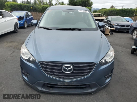 2016 Mazda CX-5 Sport with VIN JM3KE2BY4G0789618, listed as a Copart auction lot 53318245 with 52,801 mi miles and Salvage Title. Bid and sale history available at carsss.com. Image 5.