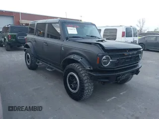 2021 Ford Bronco z VIN 1FMEE5DH0MLA77066, wystawiony jako IAAI lot #41889270 z przebiegiem 62 610 mil mil oraz . Historia ofert i sprzedaży dostępna na DreamBid. Obrazek 1.