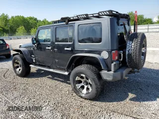 2008 Jeep Wrangler Unlimited X z VIN 1J4GA39128L518897, wystawiony jako Copart lot #52297525 z przebiegiem 163 676 mil mil oraz Nie do naprawy • Non repairable. Historia ofert i sprzedaży dostępna na DreamBid. Obrazek 2.