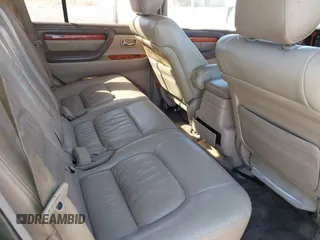 2000 Lexus LX 470 with VIN JT6HT00WXY0079873, listed as a IAAI auction lot 41605770 with 302,758 mi miles and . Bid and sale history available at DreamBid. Image 8.